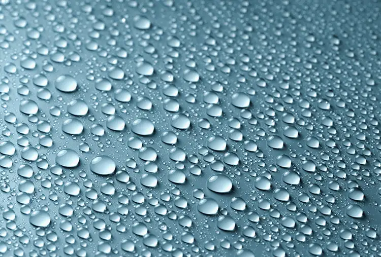 Figure 1. Water droplets on a window are an example of a fluid liking itself more than it likes the substrate.